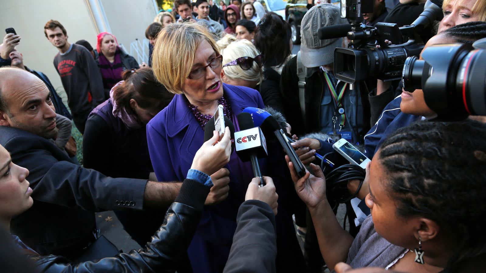 South African opposition Democratic Alliance leader Helen Zille (C) speaks to the media before casting her vote in Rondebosch, Cape Town, May 7, 2014.