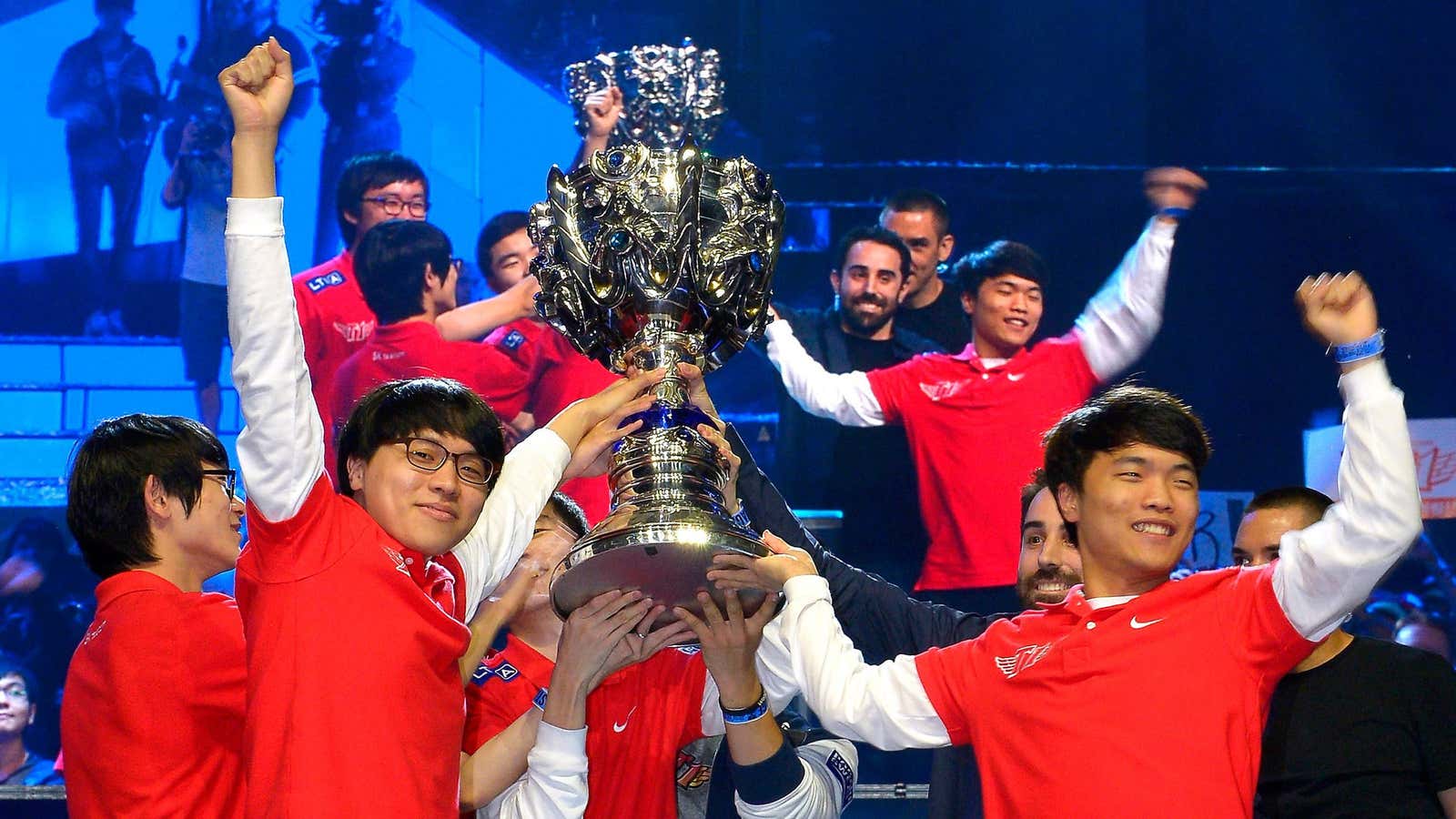 Members of Korea’s SK Telecom T1 team celebrate with their trophy after defeating China’s Royal Club at the 2013 League of Legends Season 3 World Championship Final, in Los Angeles.