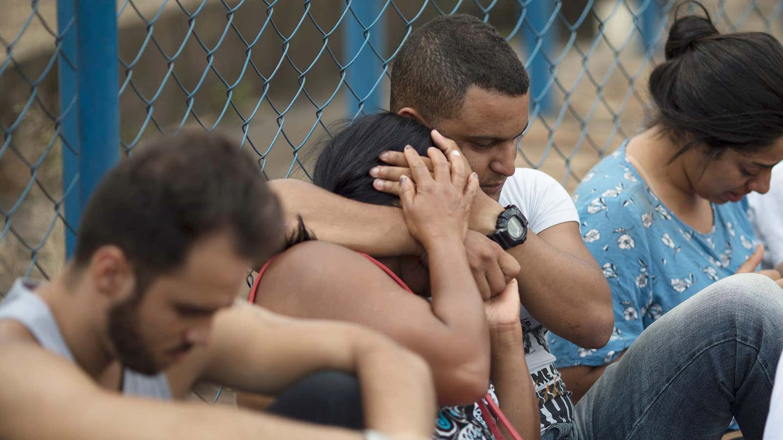 People wait for information about missing friends and relatives who disappeared after a dam collapse in Brumadinho, Brazil, on Jan. 26, 2019.