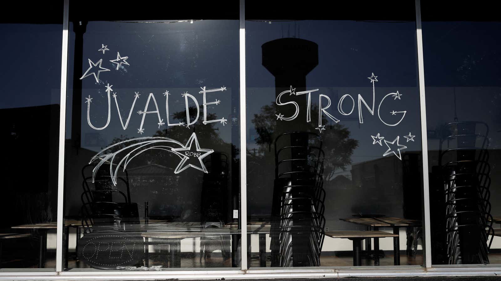 A message in solidarity with victims of the Robb Elementary school shooting is written on a storefront window, in Uvalde, Texas, U.S. May 26, 2022. REUTERS/Marco Bello