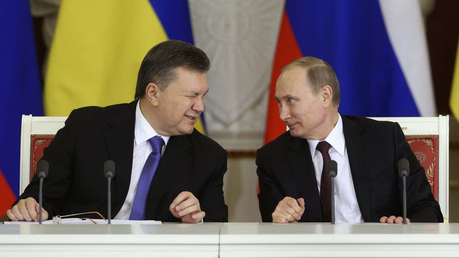 Yanukovych and Putin sign a deal with “no conditions attached.”