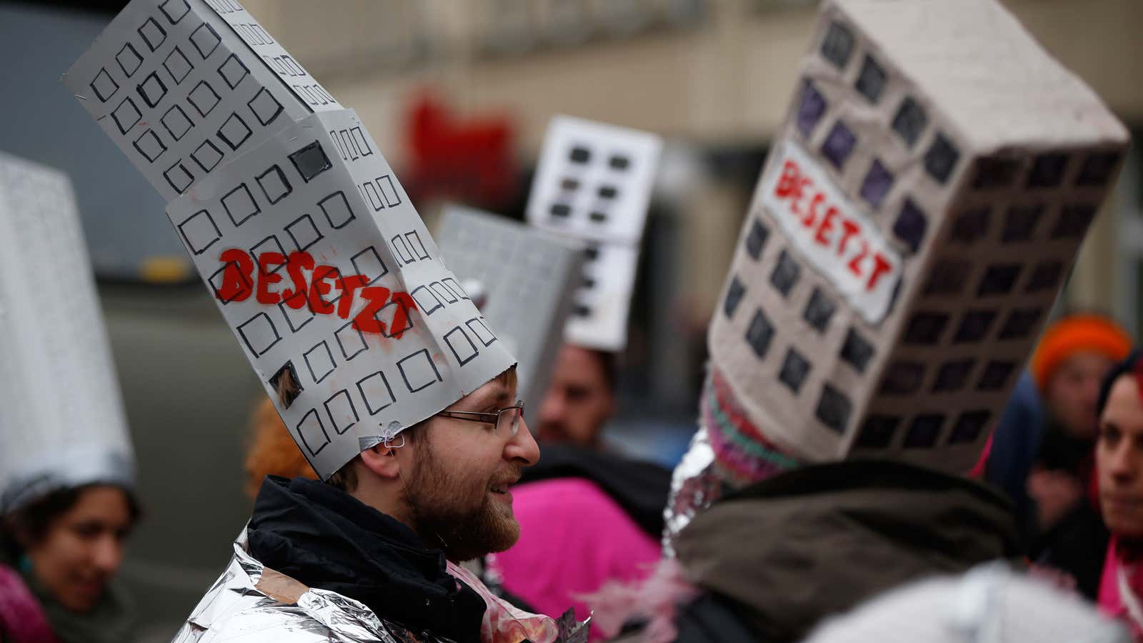 Protesters don “occupied” houses during a demonstration against soaring rents in Hamburg.