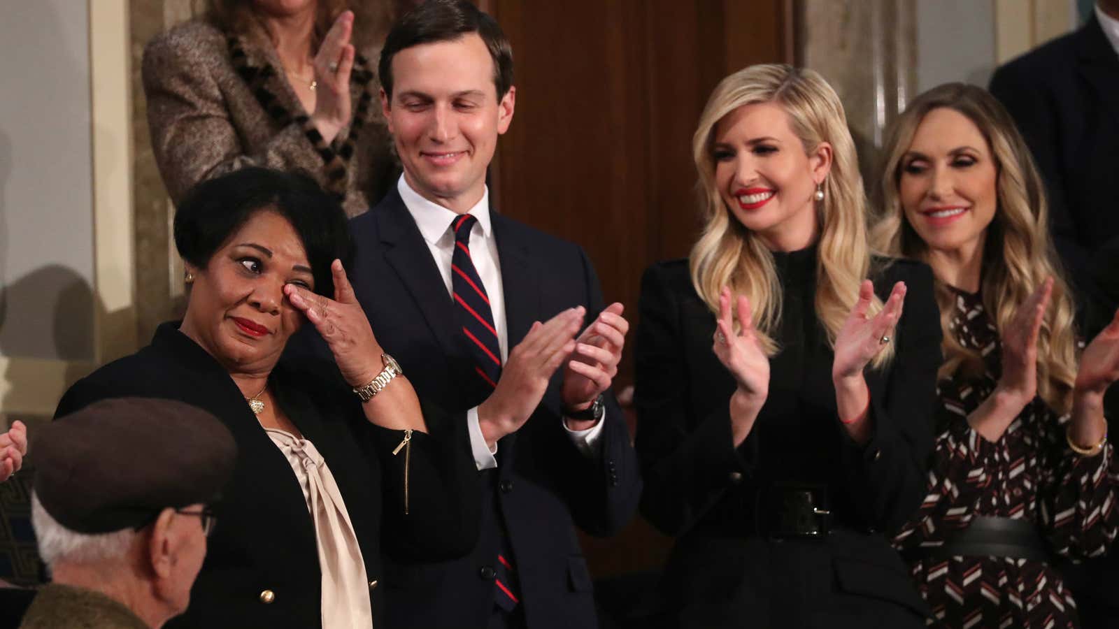 Alice Johnson, left, wipes away a tear during the president’s State of the Union address.