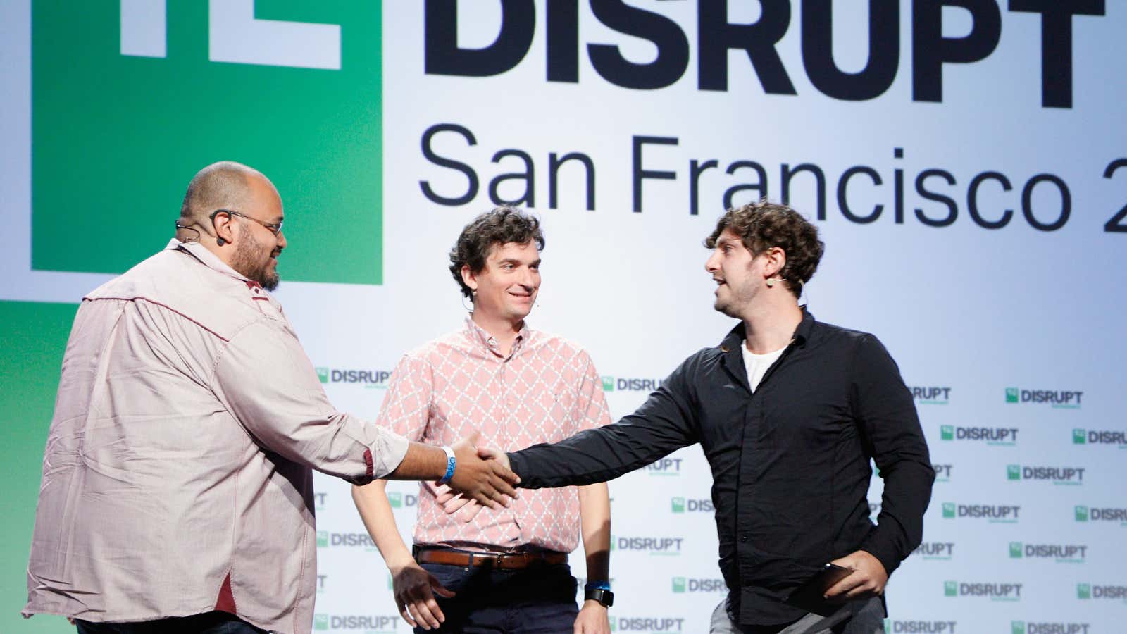 Y Combinator partners Michael Seibel and Dalton Caldwell speak at TechCrunch in 2018. Y Combinator’s online demo day is a test for startup funding.