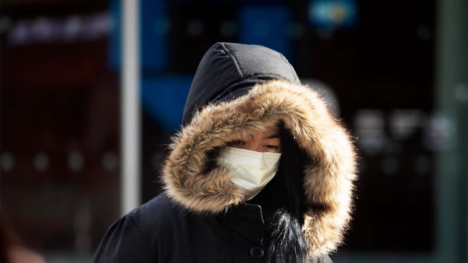 A woman wears a mask, Thursday, Jan. 30, 2020 in New York. She works in a doctor’s office and said she wears the mask “partly”…