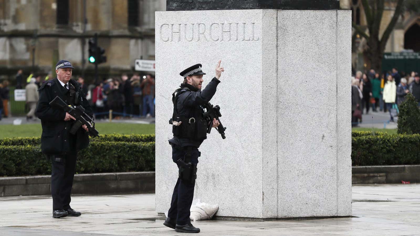 Armed police respond outside Parliament.