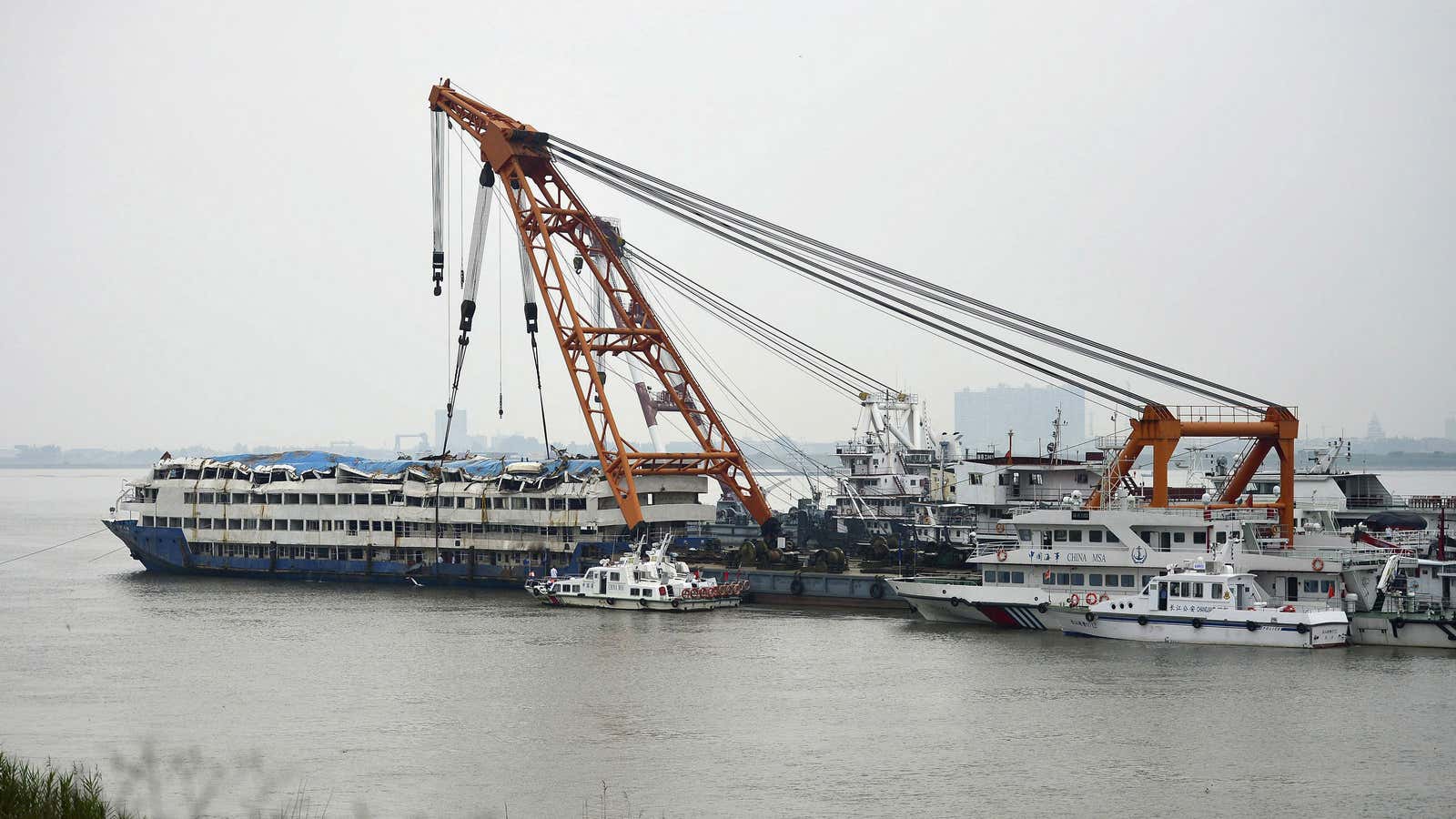 The Eastern Star cruise ship is towed after the accident.