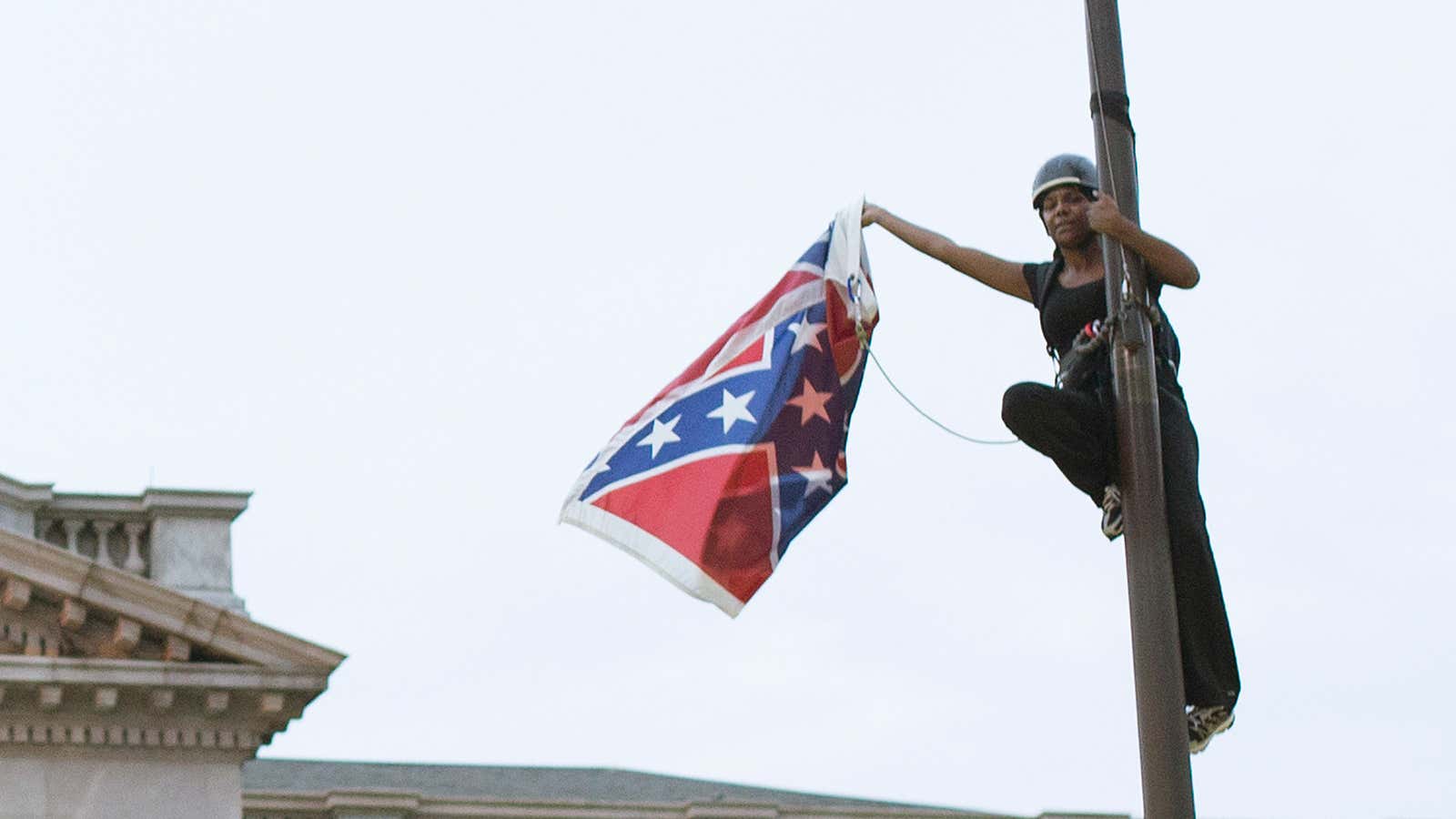 Brittany “Bree” Newsome removes the Confederate flag from a pole at the Statehouse in Columbia, South Carolina, June 27, 2015.