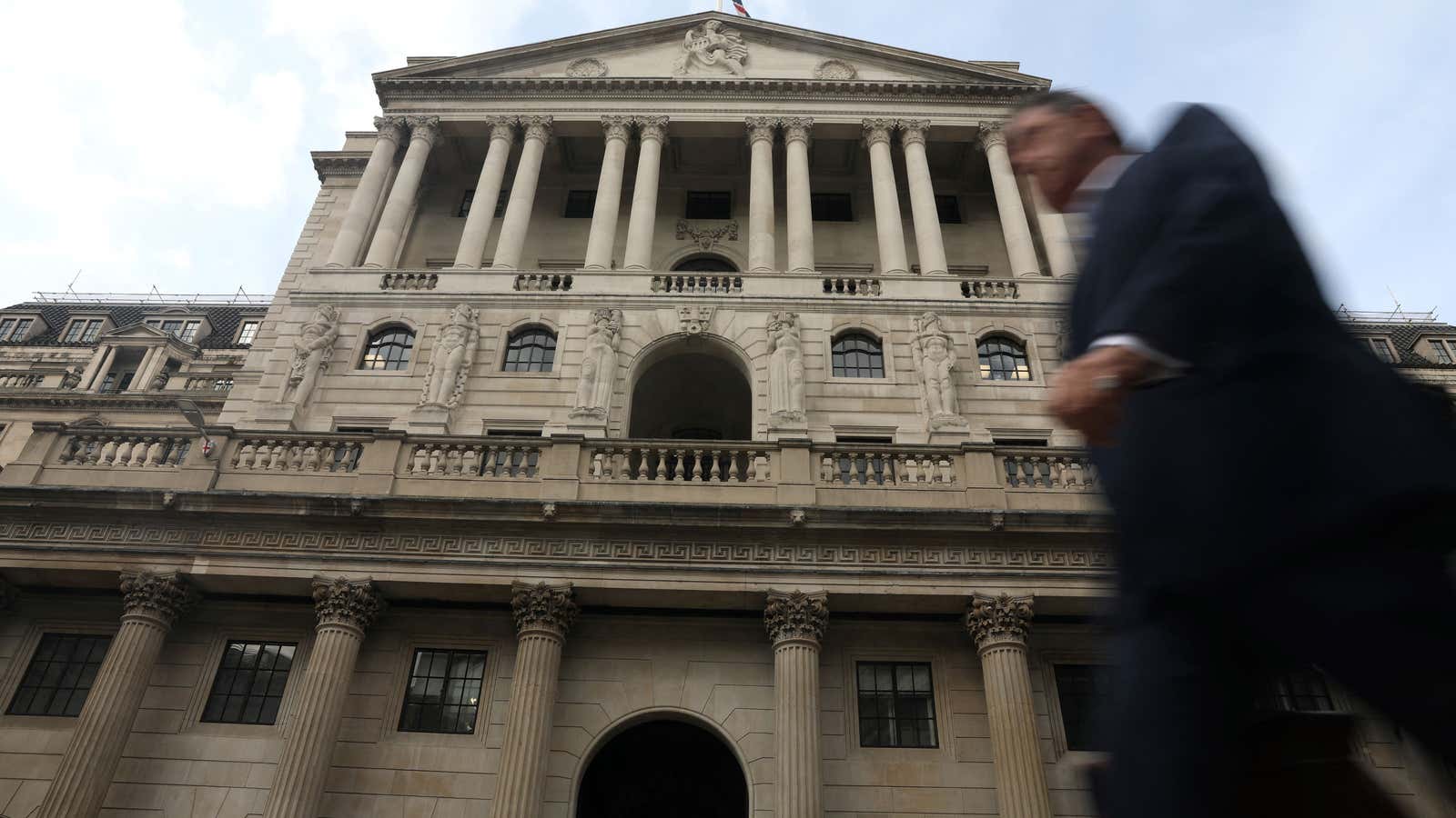 A pedestrian walks past the Bank of England in the City of London on September 22, 2022. 