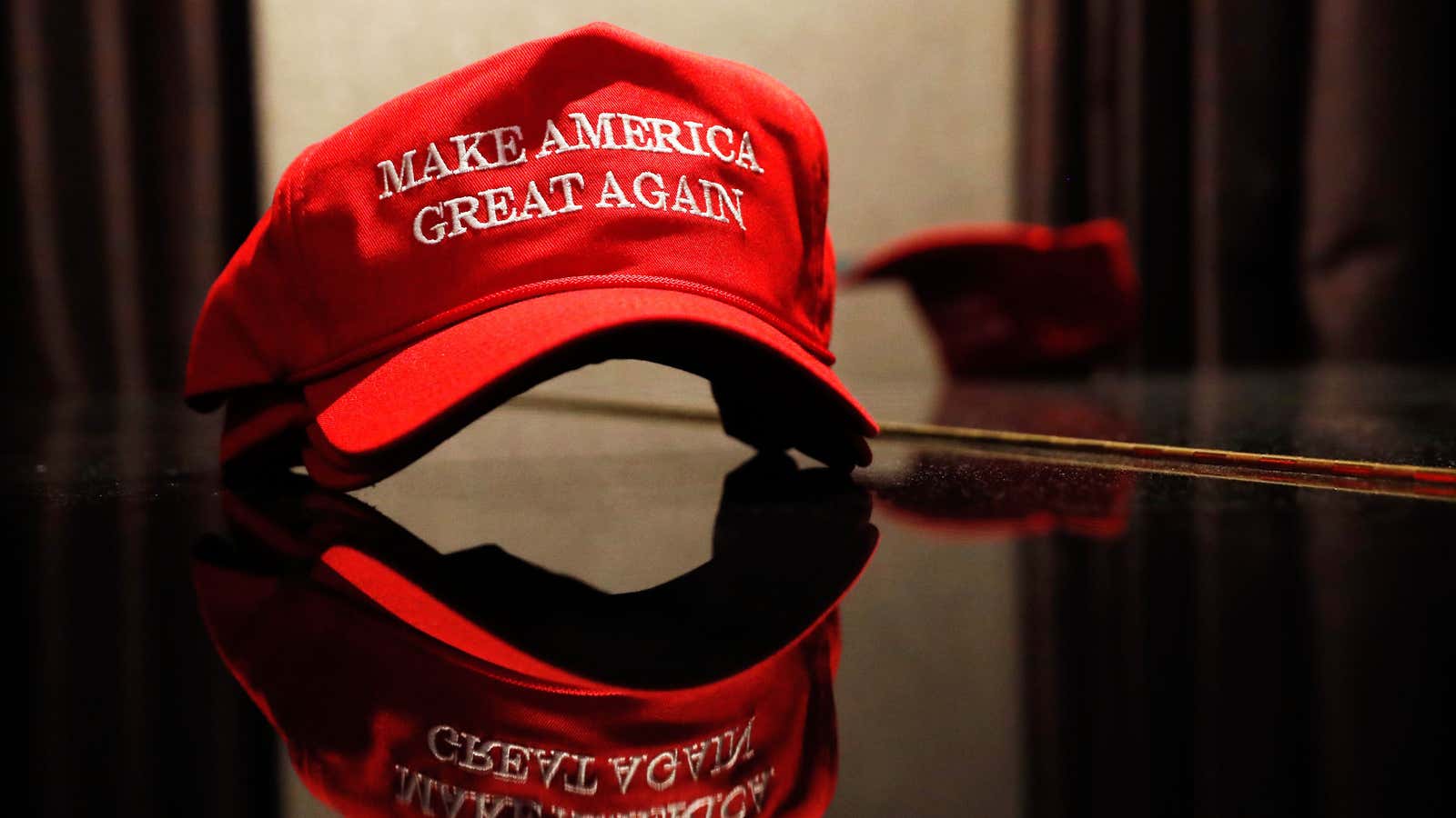 A Trump hat sits on a table outside of the rally for Republican U.S. presidential nominee Donald Trump in New York City, New York, U.S.…