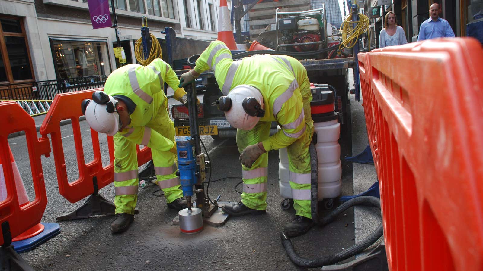 Installing a parking sensor on London’s Savile Row.