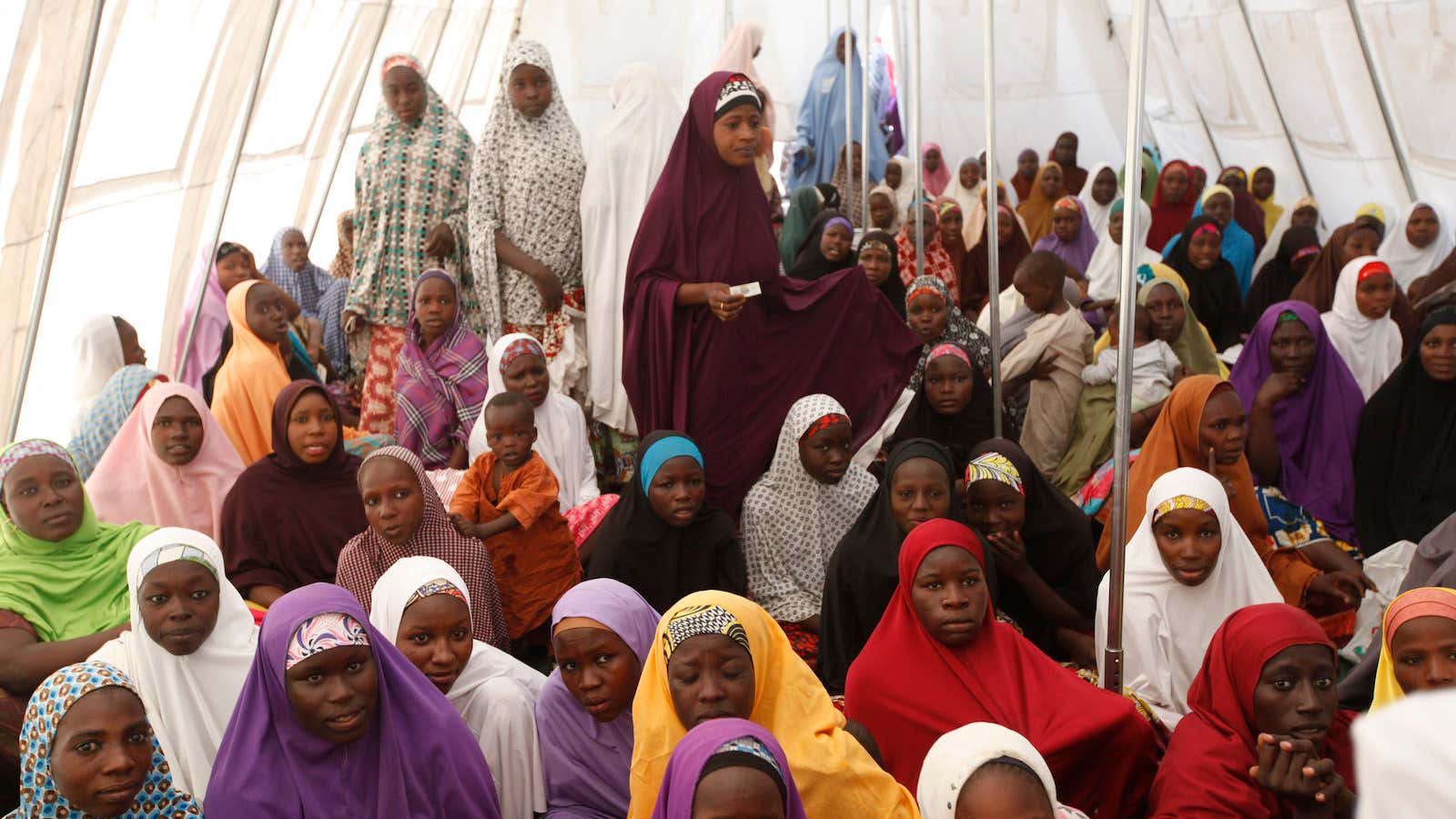 Children displaced by Boko Haram in an attack on their villages receive lectures in  a camp in Maiduguri, Nigeria.