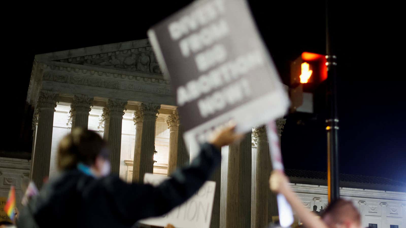 Protesters react to the leak of a draft majority opinion which would overturn Roe v. Wade.