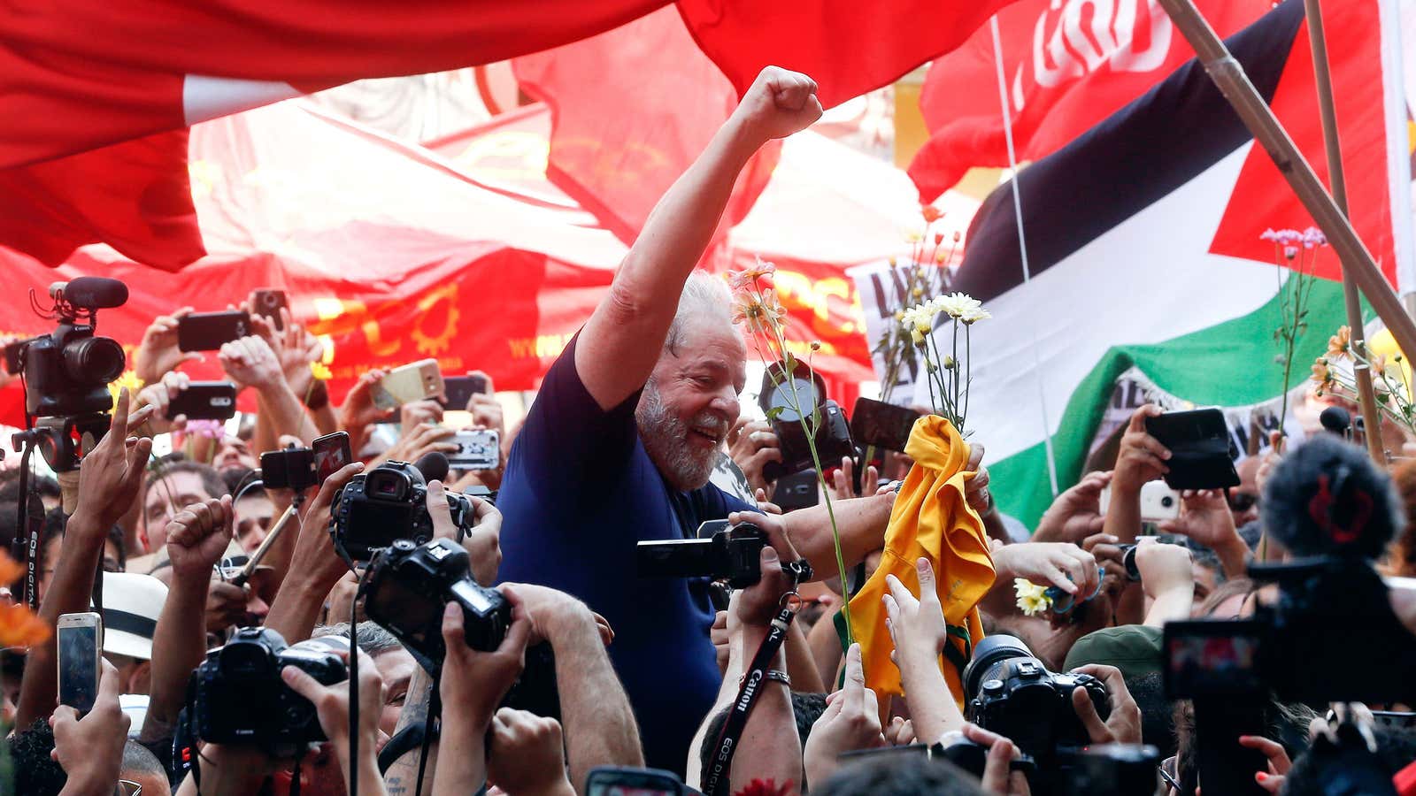 Brazilian former President Luiz Inacio Lula da Silva is carried alfot by supporters outside the metallurgic union headquarter in Sao Bernardo do Campo, Brazil, Saturday,…