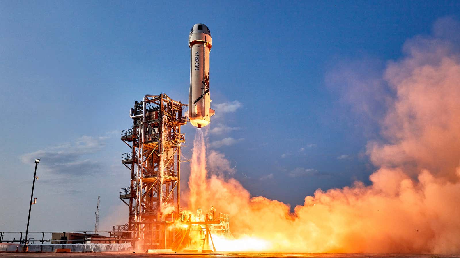 A Blue Origin New Shepard rocket takes off carrying four passengers, including Jeff Bezos, on July 20, 2021.