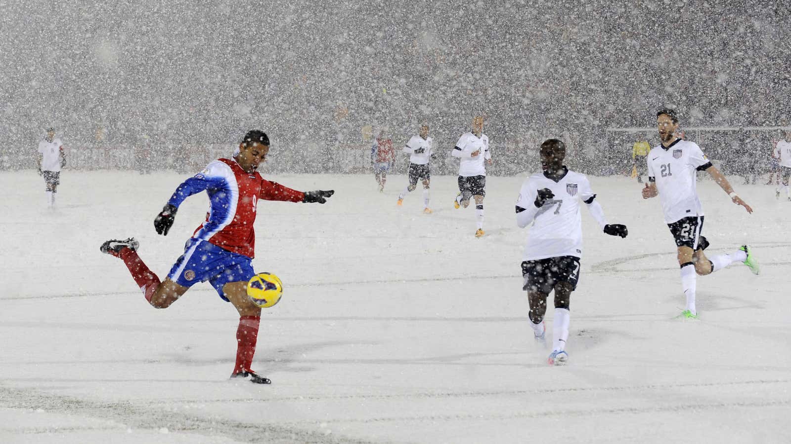 Costa Rica forward Alvaro Saborio takes a very snowy shot on goal.