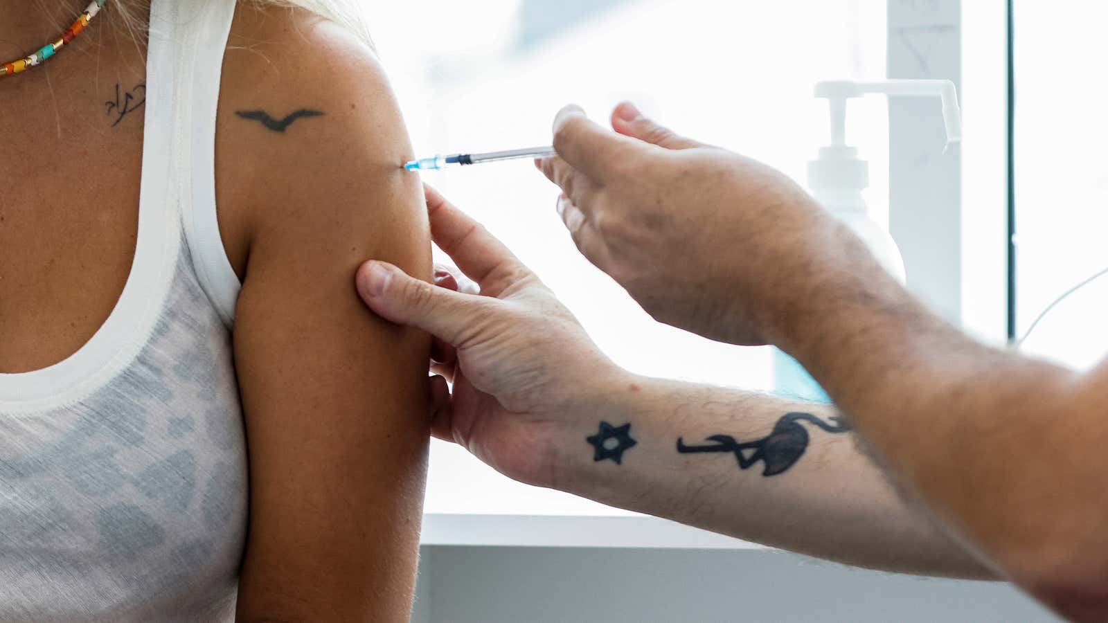 An Israeli woman receiving her third shot in Tel Aviv.