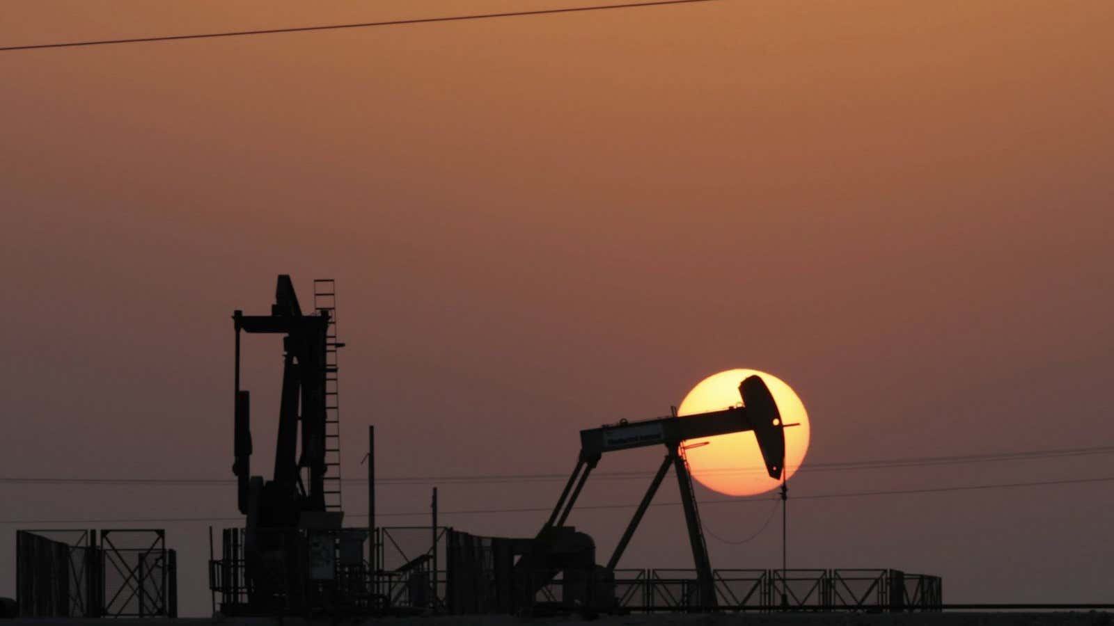 An oil pump works at sunset Wednesday, Sept. 30, 2015, in the desert oil fields of Sakhir, Bahrain. Consumer prices across the 19-country eurozone fell…