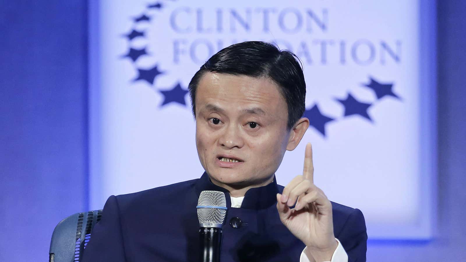 Alibaba chairman Jack Ma displays his left index finger.