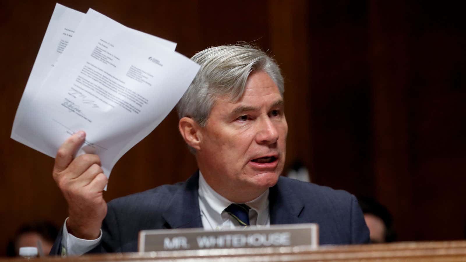 Sheldon Whitehouse brandishes documents during a Senate Judiciary Committee hearing for Brett Kavanaugh’s supreme court nomination.