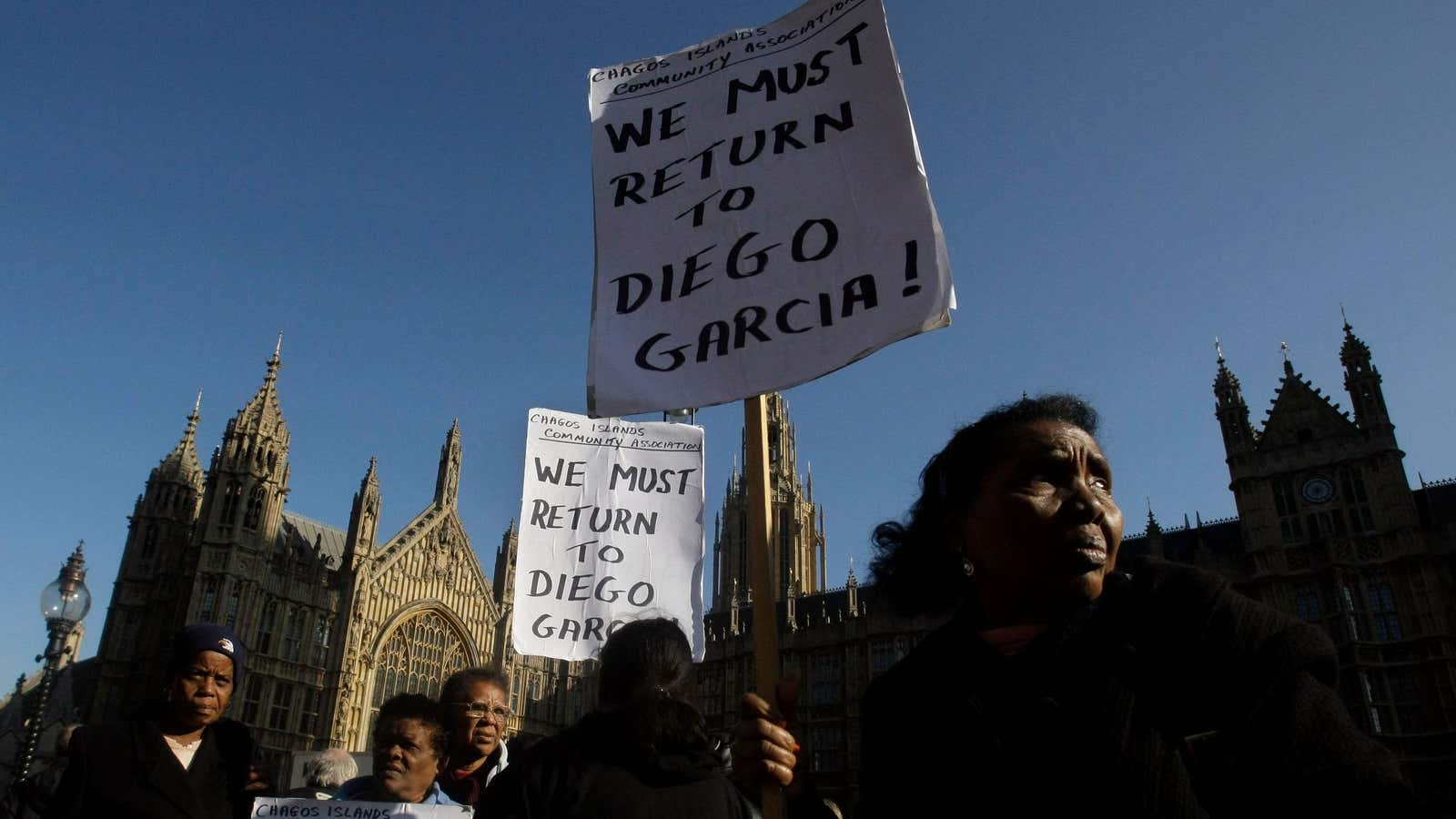 Chagos Islanders protes outside the Houses of Parliament in London,