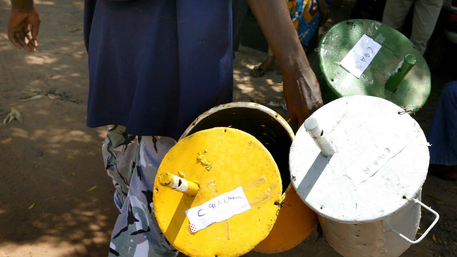 Votes are cast by slipping marbles into “ballot drums.”