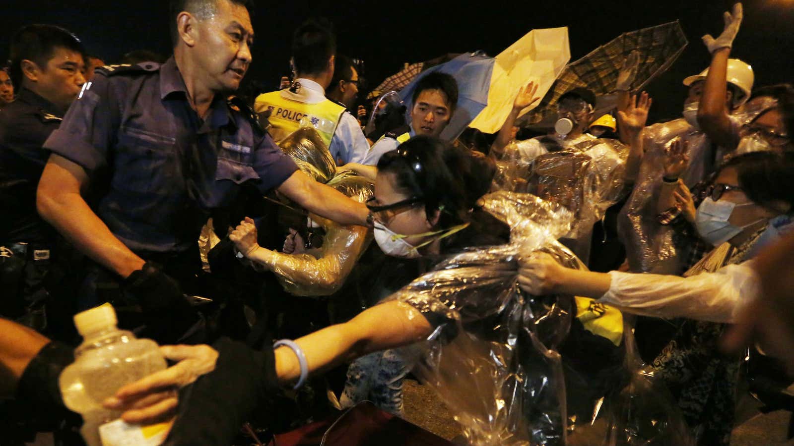 Police and protesters outside of Hong Kong government offices early Wednesday morning.