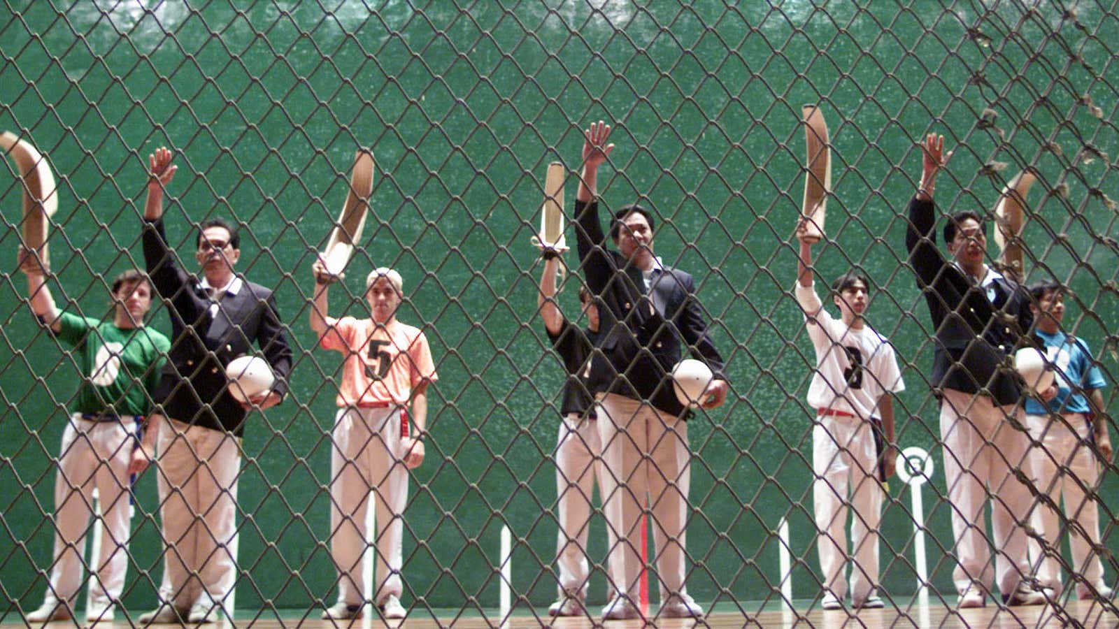 Filipino and Spanish jai-alai players raise their hands and scoop-like baskets at the start of games in a 2,600-seater fronton in central Manila June 22. The fronton was renovated at a cost of one billion pesos by two firms which formed a joint venture with state firm Philippine Amusement and Gaming Corp. Jai-alai, a kind of handball played with a basket strapped to the wrist, resumed in the country June 22 after about a decade of absence as it was banned by the government due to the gambling associated with the popular sport.
EDC/TAN