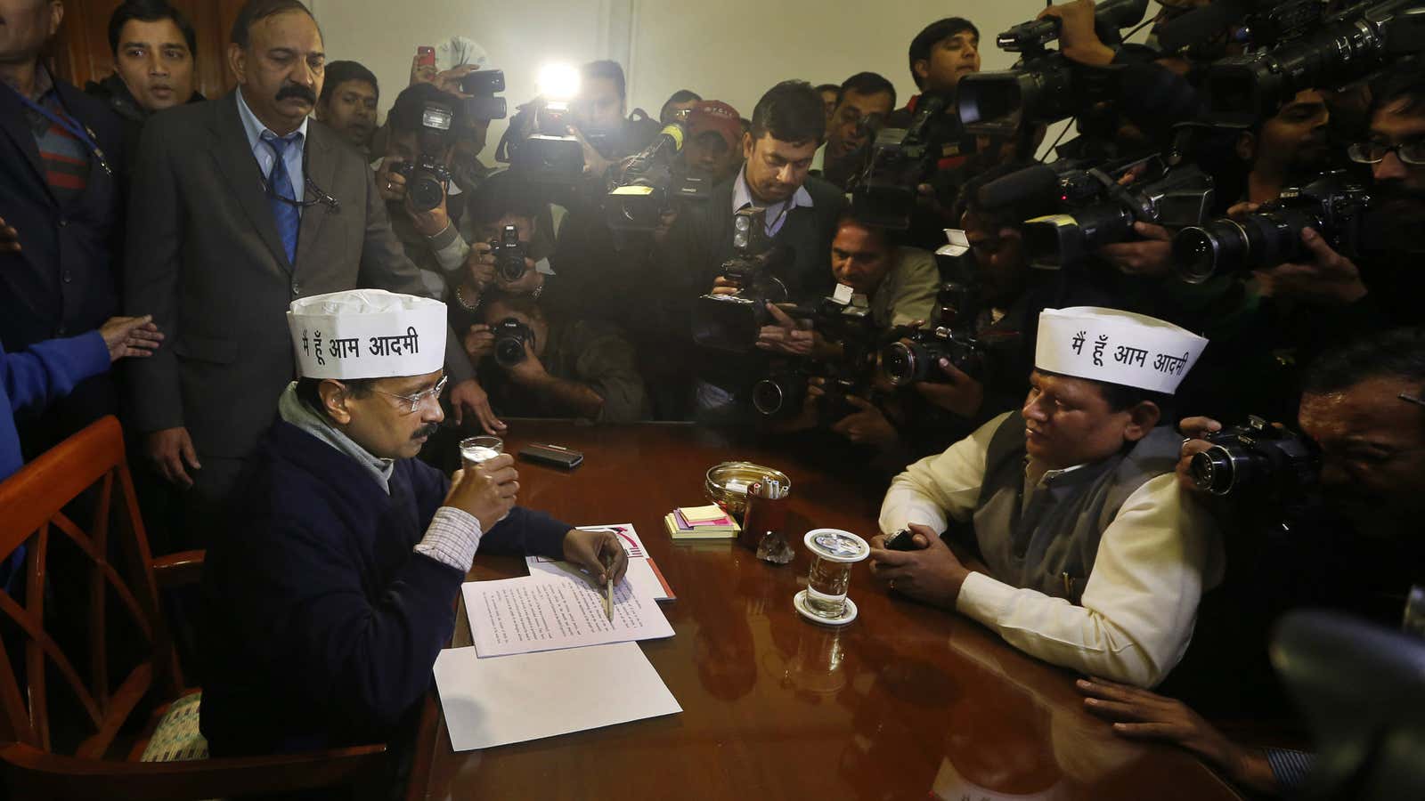 Maybe he should not have drank that. Kejriwal (l) on Dec. 30.