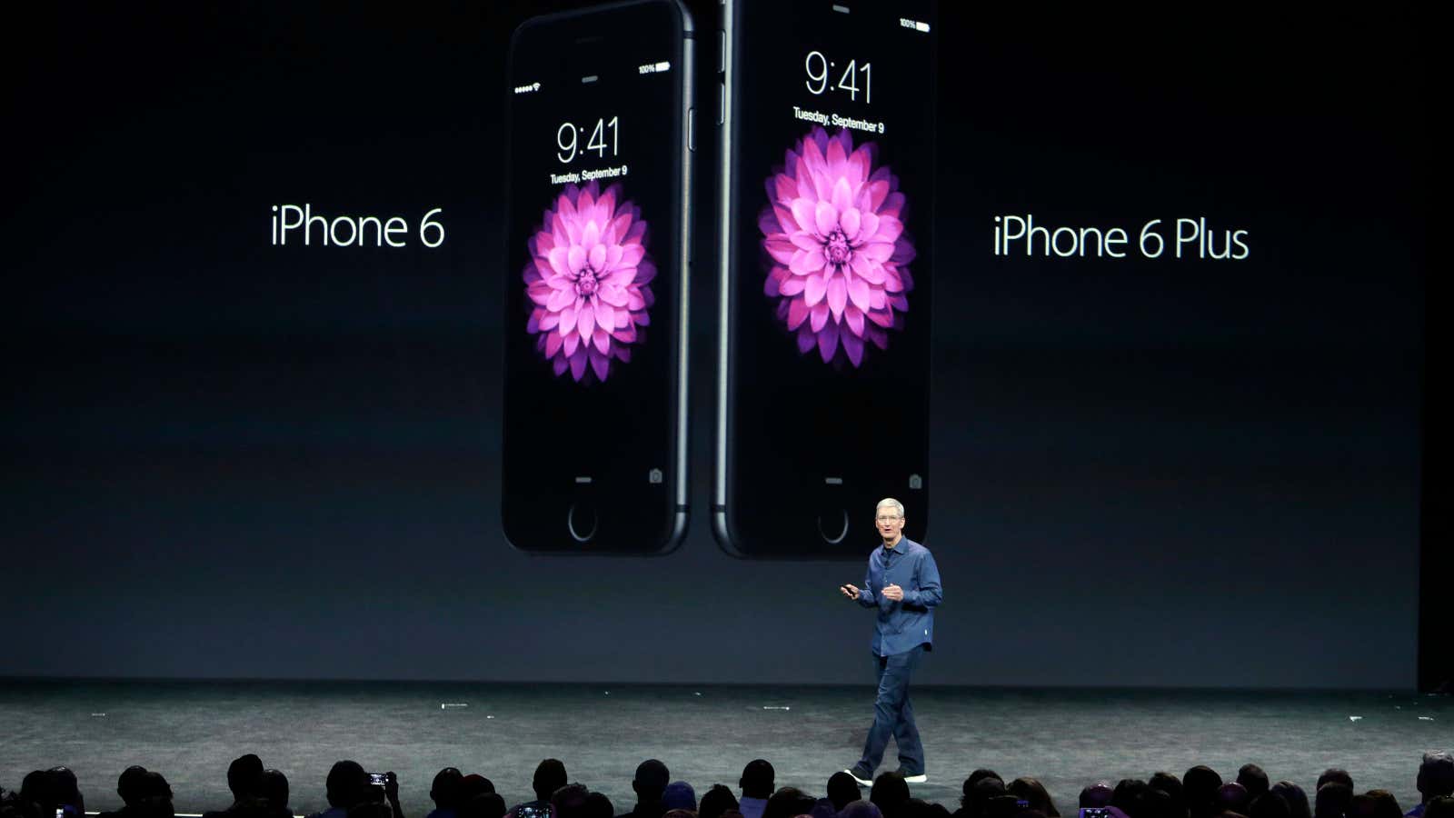 Apple CEO Tim Cook introduces the new iPhone 6 and iPhone 6 Plus on Tuesday, Sept. 9, 2014, in Cupertino, Calif. (AP Photo/Marcio Jose Sanchez)