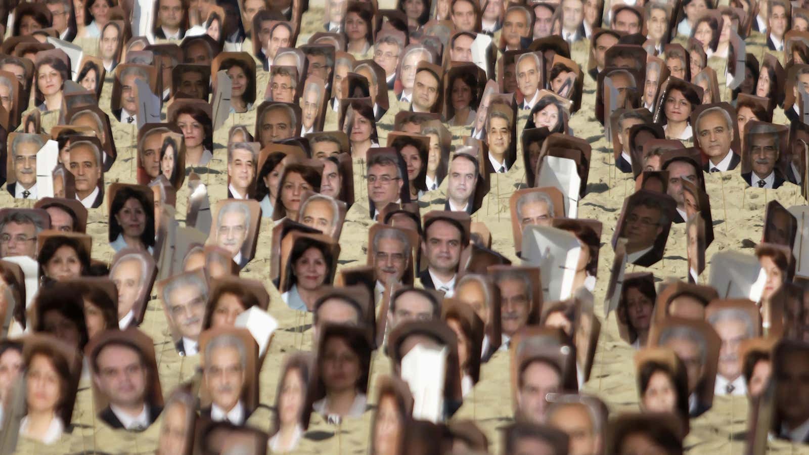 Protesters in Rio de Janeiro hold up photos of the seven Baha’i leaders detained by Iran in 2008.