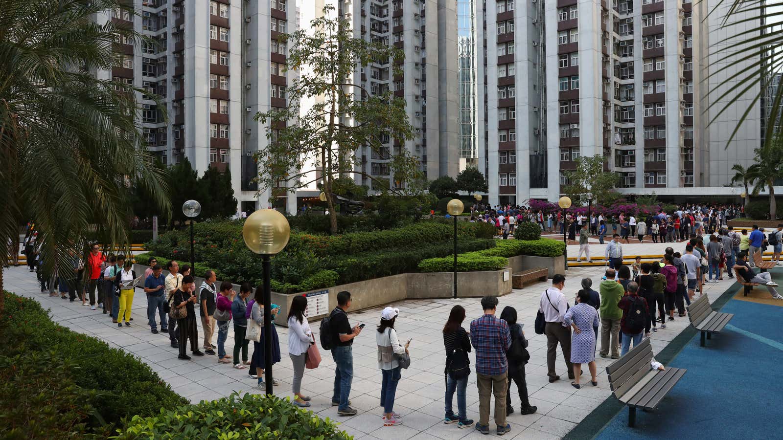 Voters line up around a square at a Hong Kong polling station.