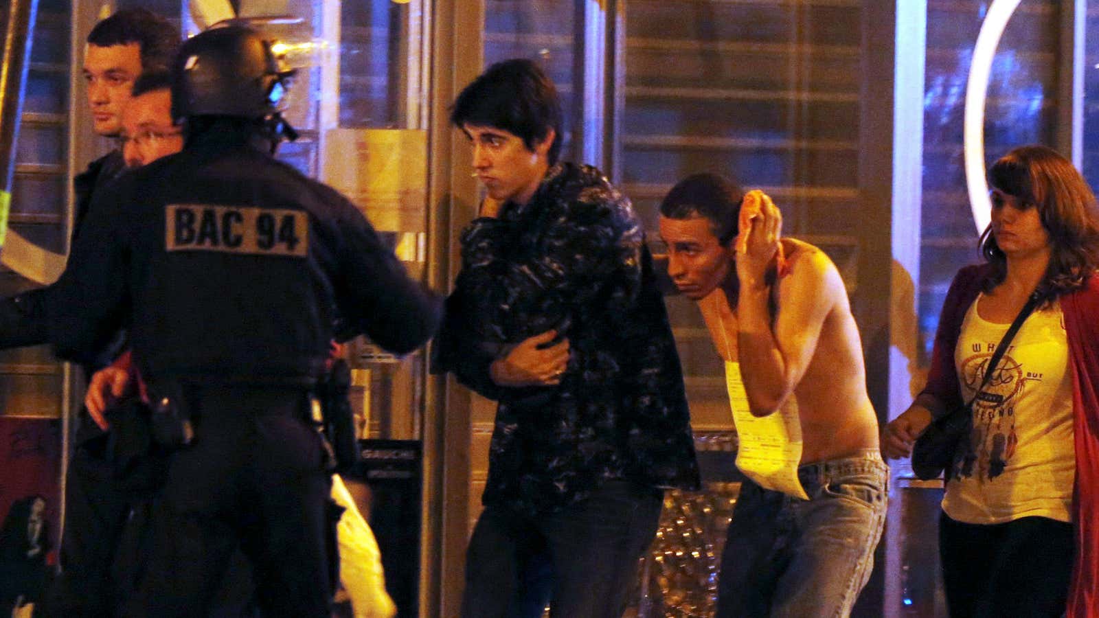 French special forces evacuate people near the Bataclan concert hall following fatal shootings in Paris, France.