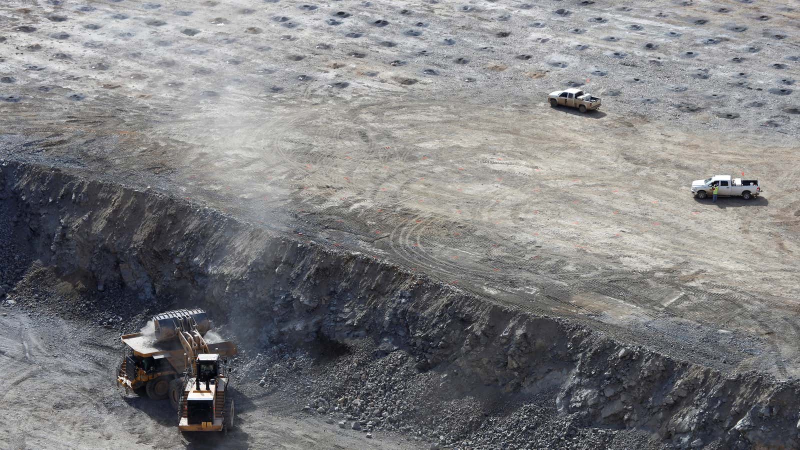 A wheel loader operator fills a truck with ore at the MP Materials rare earth mine in Mountain Pass, California, U.S. January 30, 2020. Picture…