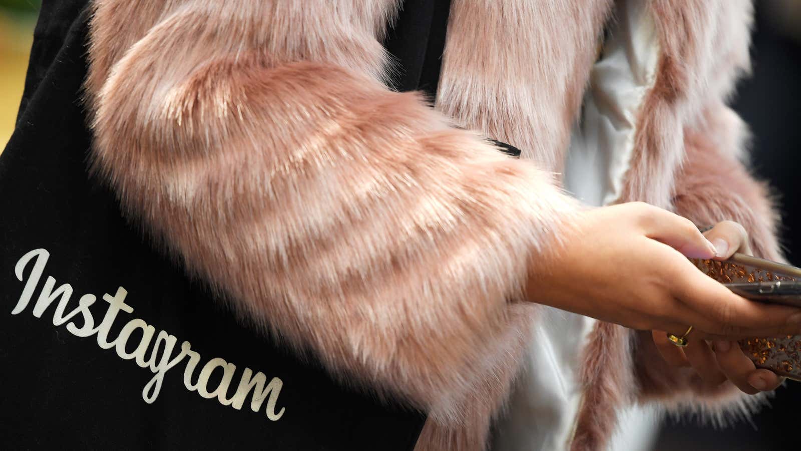 A woman carries an Instagram branded bag at Facebook’s headquarters in London.