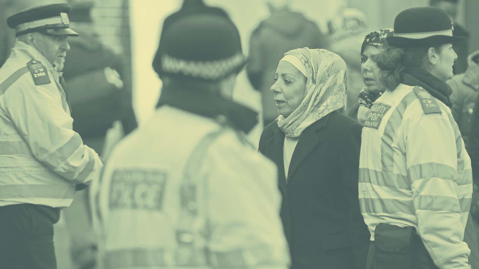 Police officers patrol Muslim Londoners as they leave services at the city’s Central Mosque.