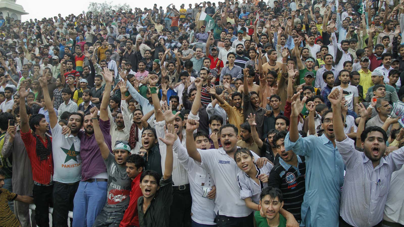 A Pakistani crowd celebrates their independence day at a border crossing with India.