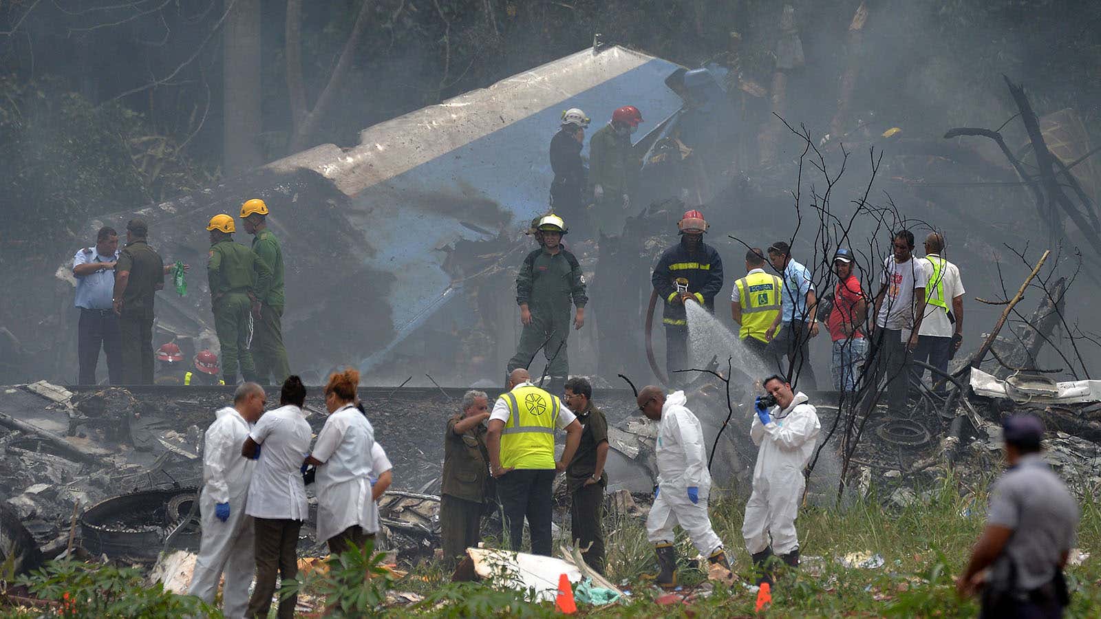 Emergency personnel works at the site of the accident after a Cubana de Aviacion aircraft crashed near Havana’s airport.