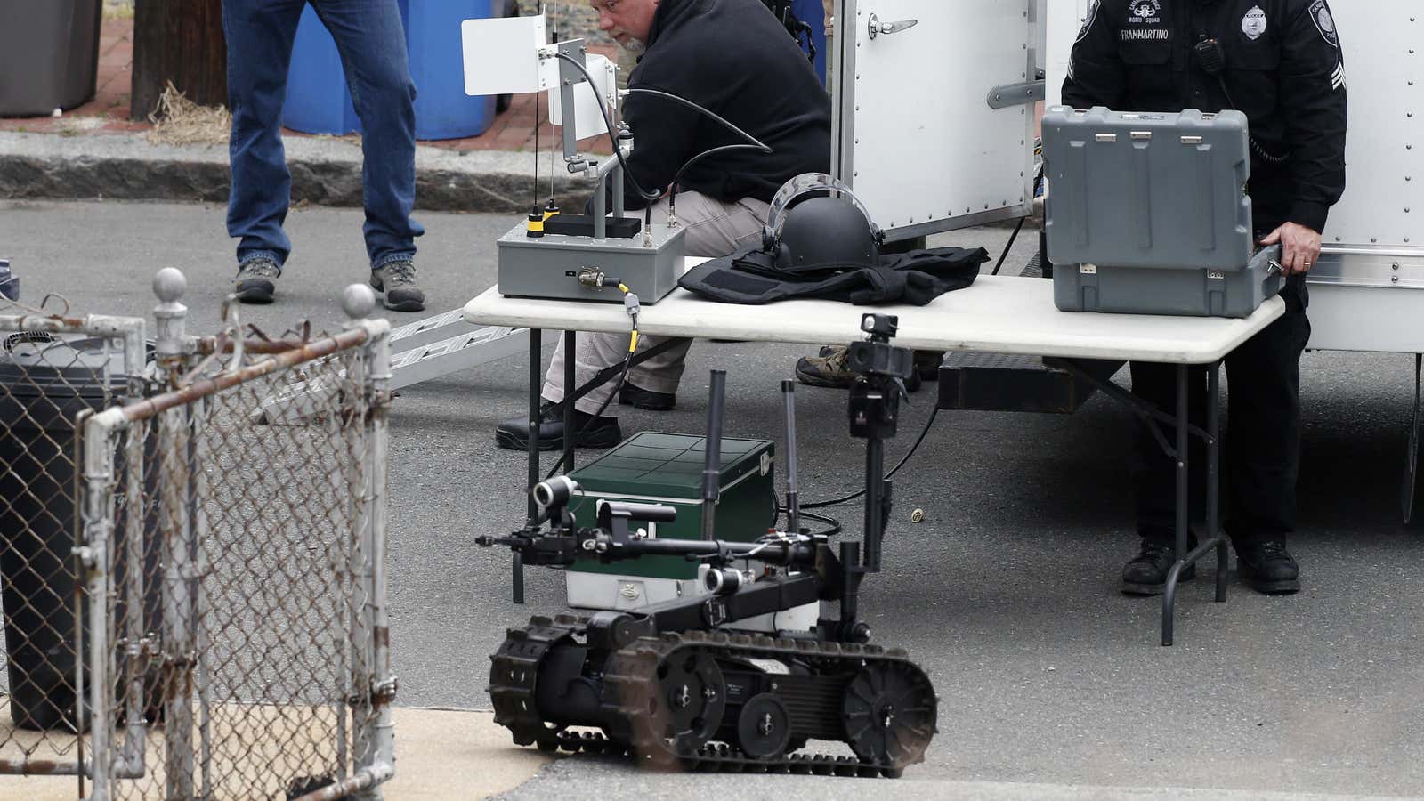 A police-deployed robot scours Norfolk Street in Cambridge earlier this morning.