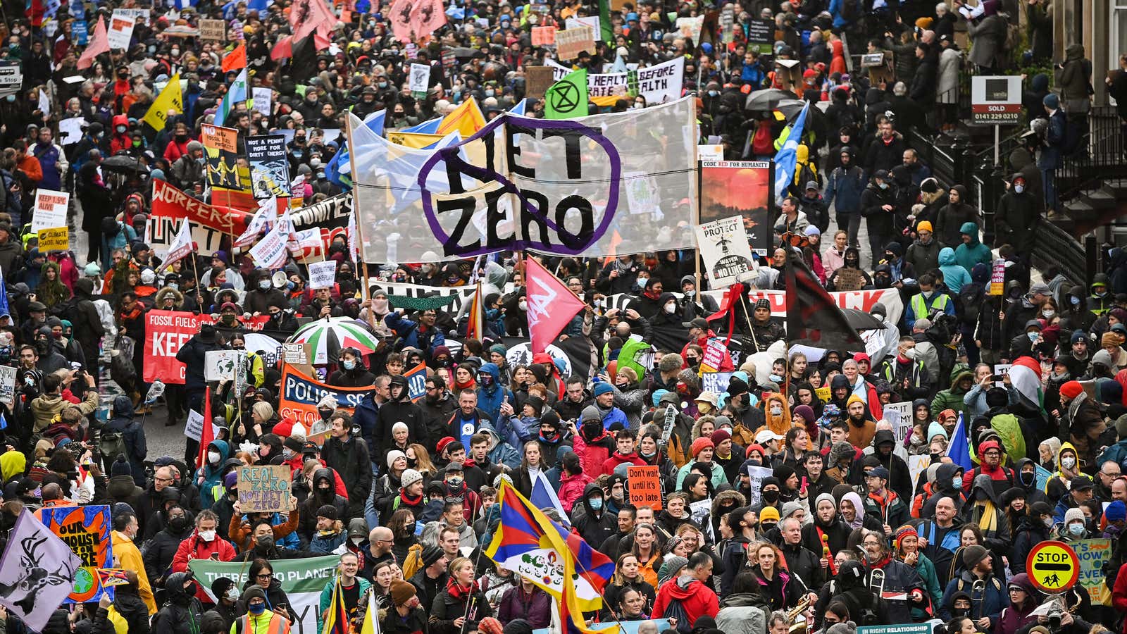 Climate protesters carrying signs and banners fill the streets at the Global Day of Action for Climate Justice march on November 6, 2021 in Glasgow,…