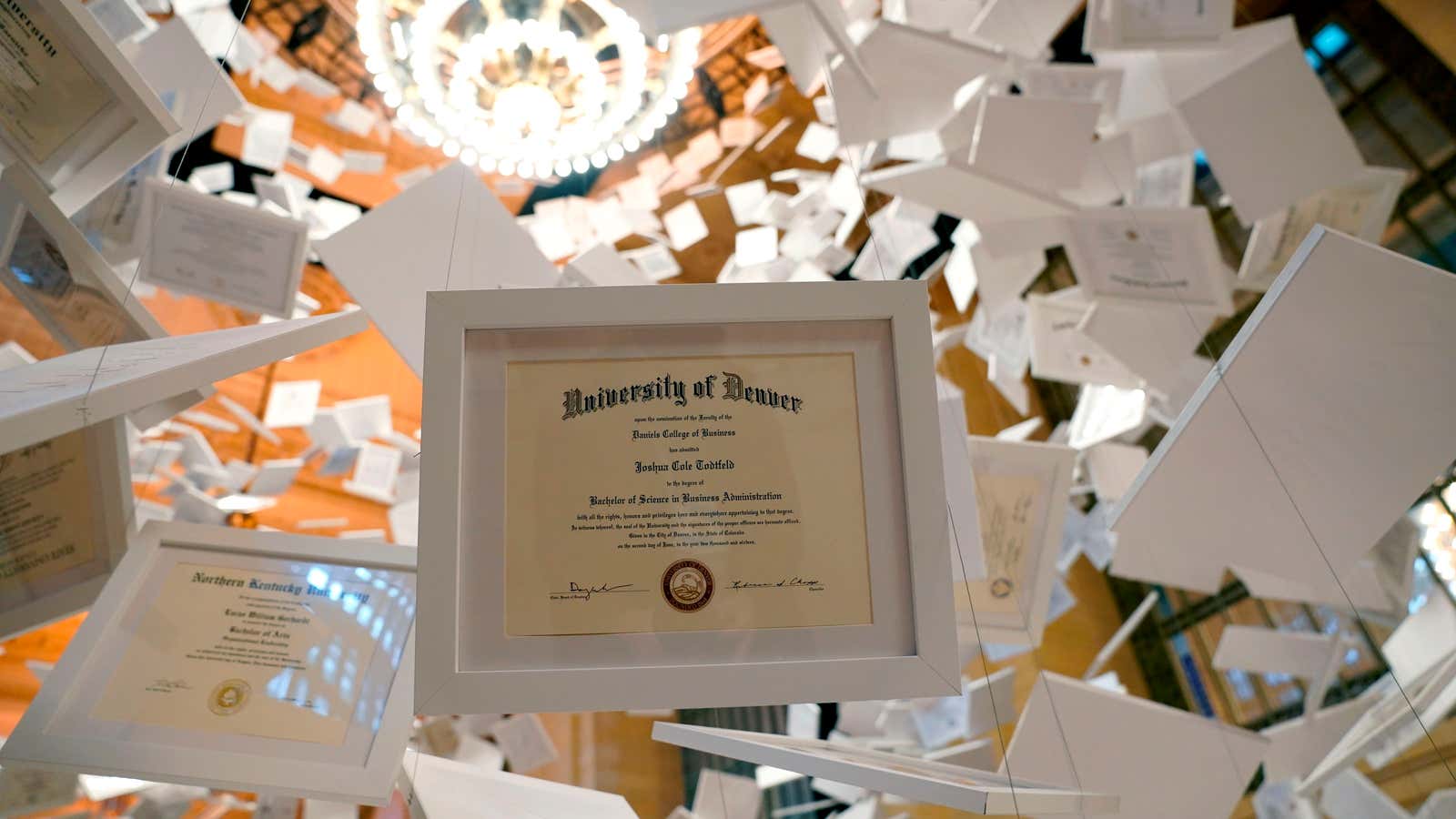 The &quot;Da Vinci of Debt&quot; artwork is made up of 2,600 authentic college diplomas from real graduates across the country. The exhibit, put on by Natural Light Beer, was created to represent the average total cost of a four-year college education, $180,000, resulting, with the total diplomas, in an art piece worth $468 million. 