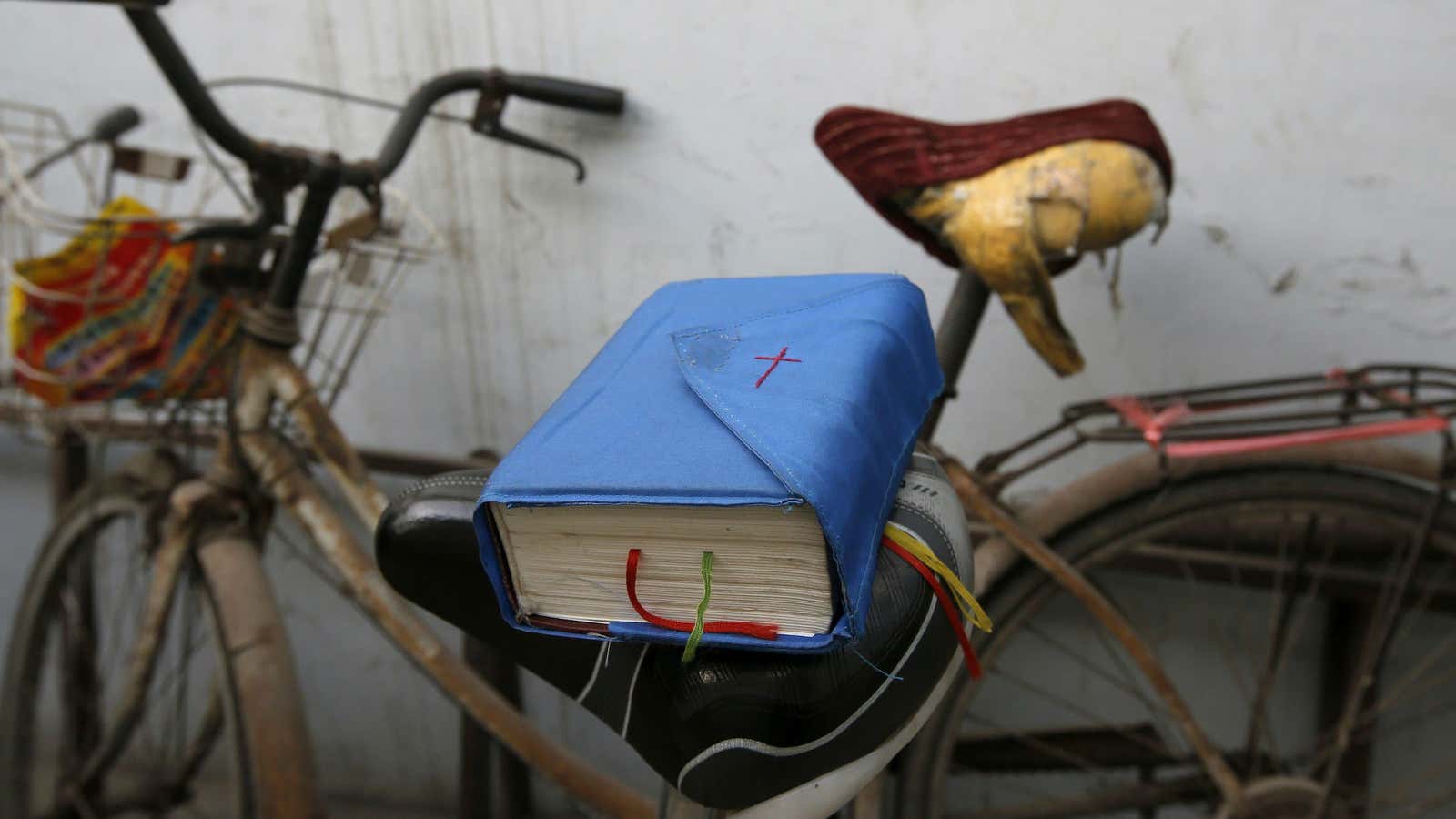 A bible is placed on a bicycle saddle at an underground Catholic church in Tianjin, China.