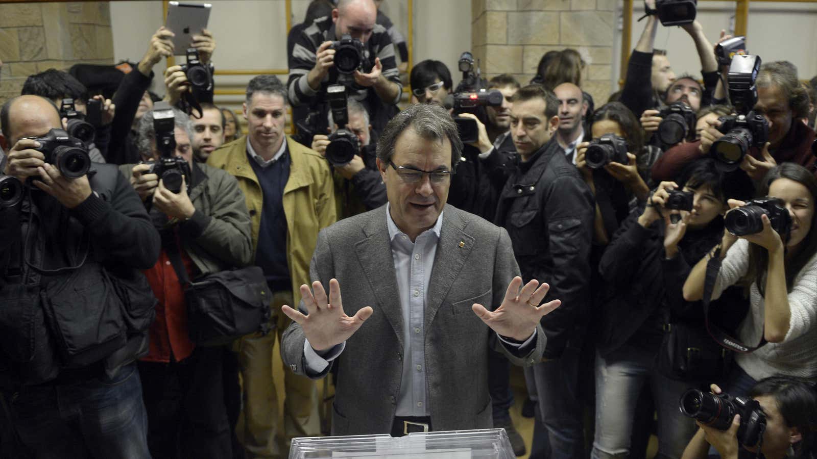 Catalonia President Artur Mas votes in regional elections Sunday where his Catalan Nationalist Coalition party lost ground