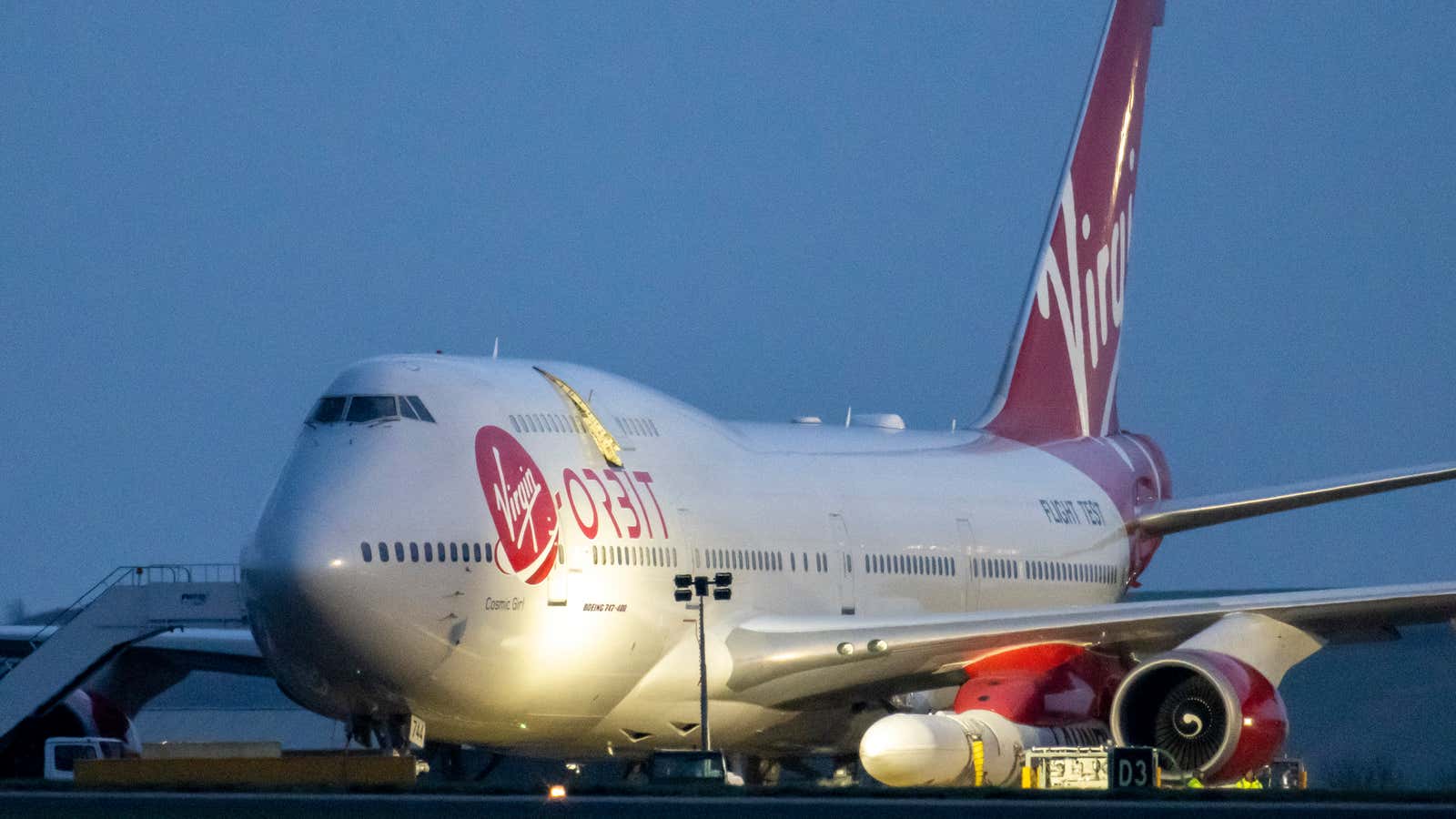 A general view of Cosmic Girl, a Boeing 747 aircraft carrying the LauncherOne rocket under its left wing, as final preparations are made at Cornwall Airport Newquay, UK on January 9, 2023.