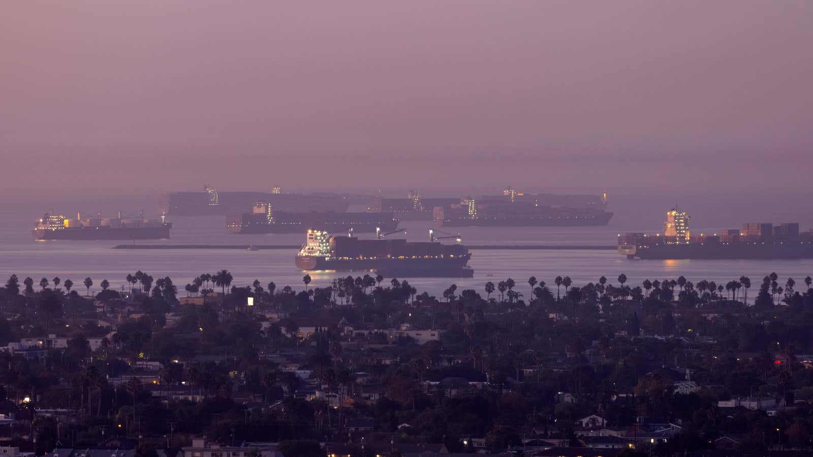 Cargo ships wait to be unloaded at the Port of Long Beach.