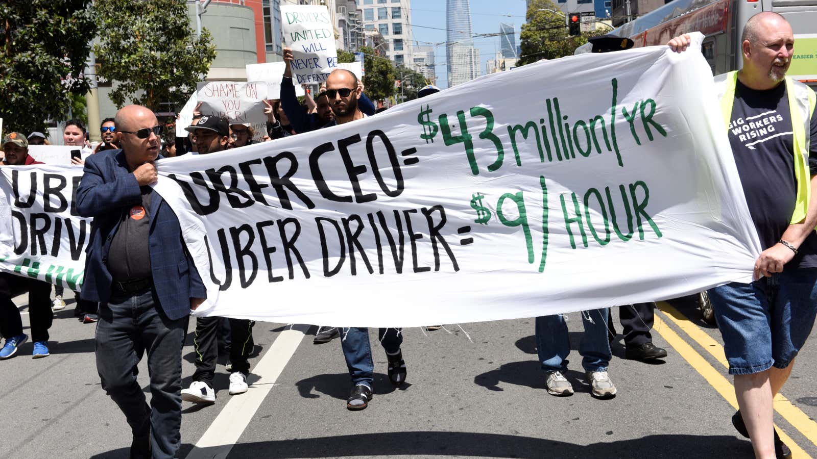 Uber protestors march in San Francisco on May 8, 2019, for a global driver strike.