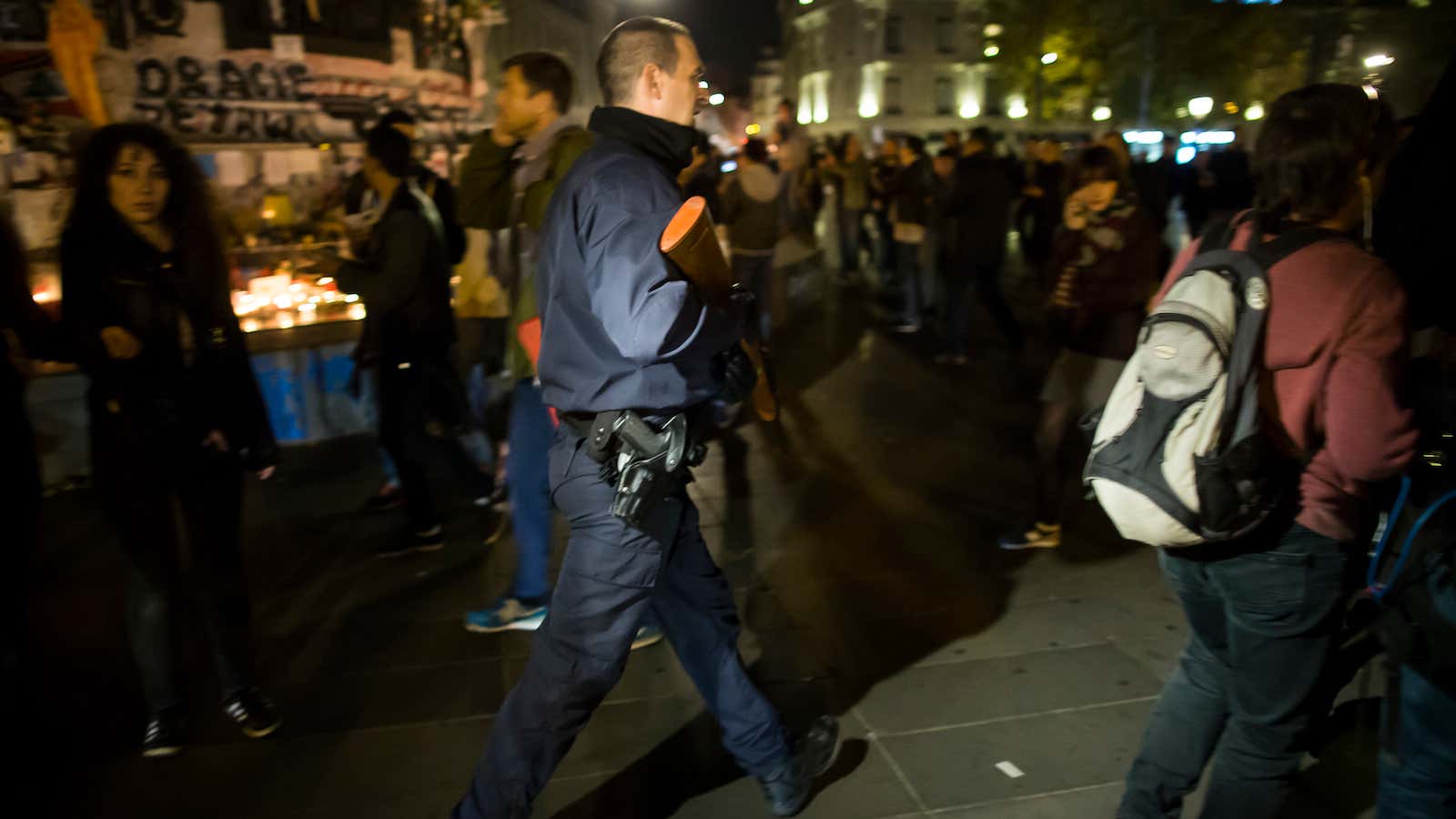 Armed French police officers patrol on Place de la Republique, Paris.