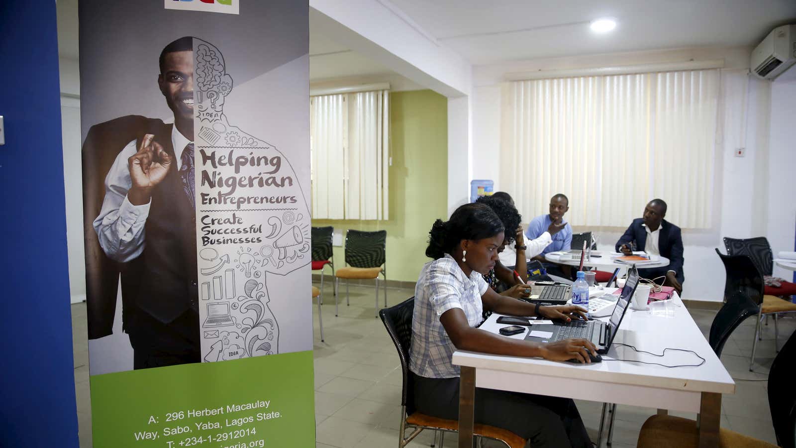 Software developers work on computer sytems at the Information Technology Developers Entrepreneurship Accelerator (iDEA) hub in the Yaba district in Lagos June 25, 2015. At…