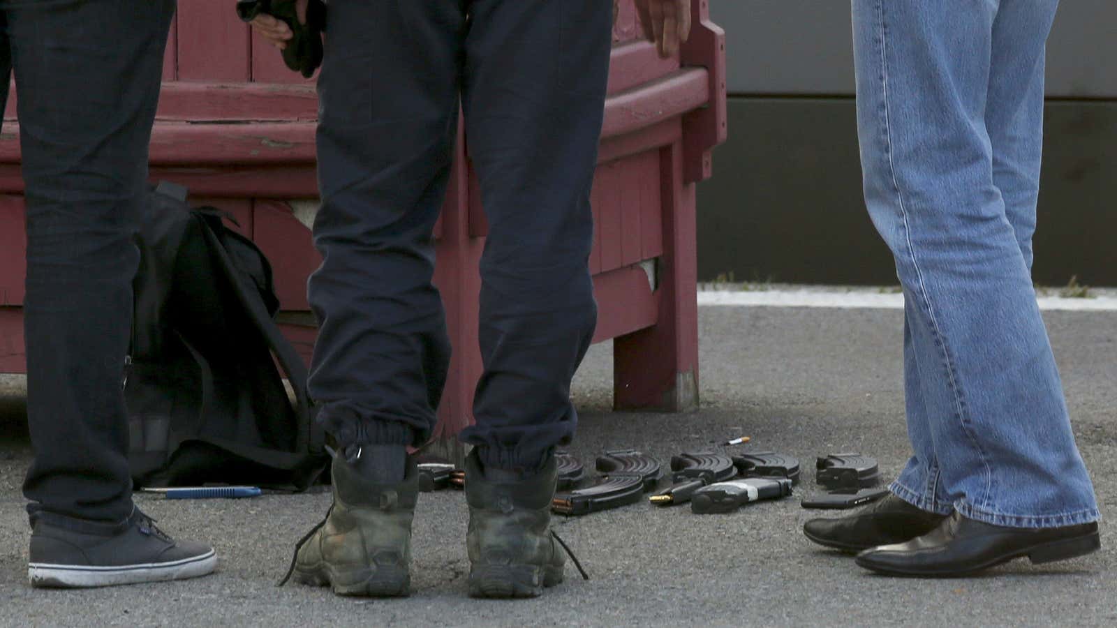 French judicial police stand on the train platform near weapon cartridges and a backpack in Arras, France, August 21, 2015.