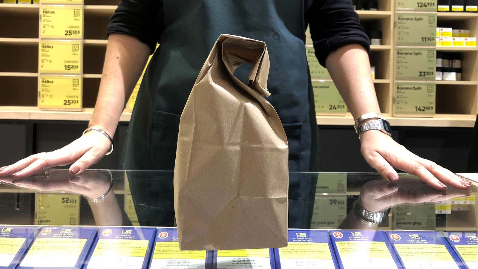 A salesclerk in the Quebec Cannabis Society (SQDC) store finishes bagging a purchase as Canada legalizes recreational marijuana, in Montreal, Quebec, Canada, October 17, 2018.…